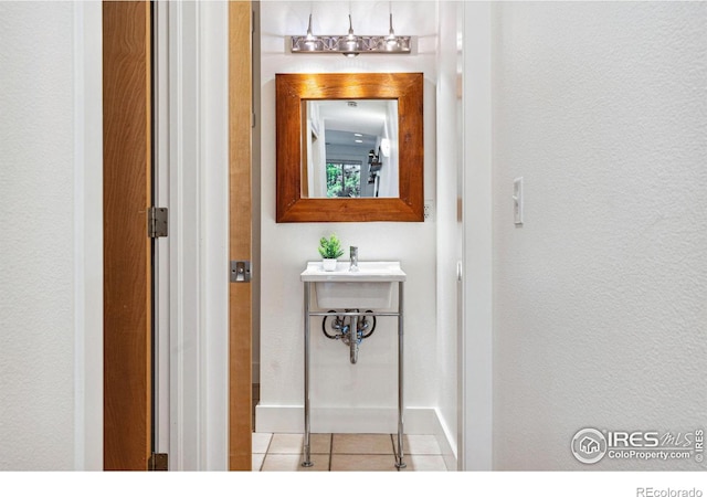 bathroom featuring tile patterned floors and baseboards