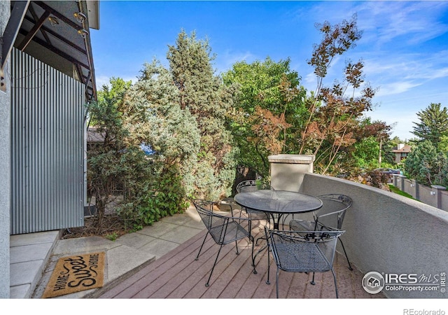 wooden deck featuring outdoor dining space