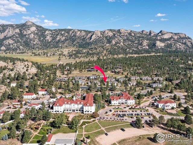 drone / aerial view featuring a mountain view