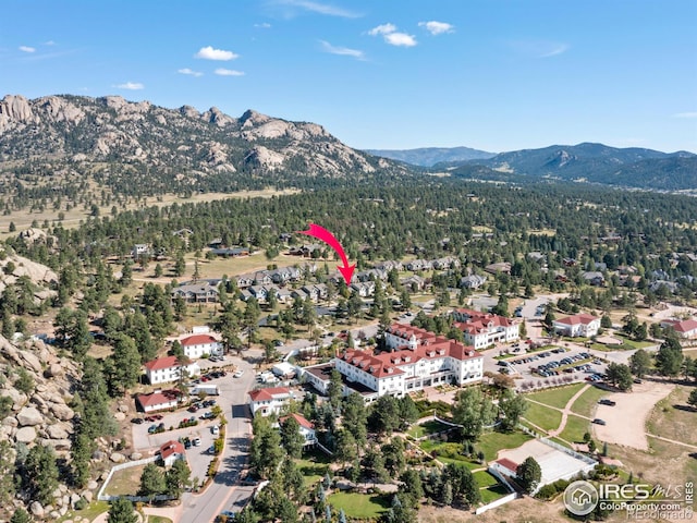 birds eye view of property with a mountain view