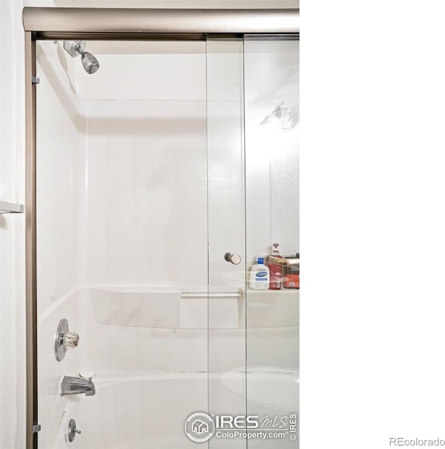 bathroom featuring enclosed tub / shower combo