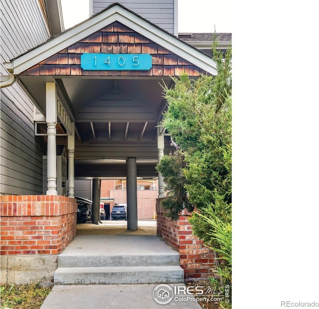 entrance to property with a carport