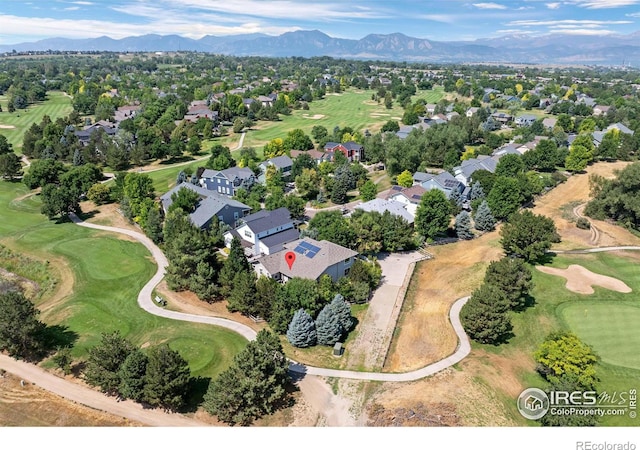 aerial view with a mountain view, a residential view, and view of golf course