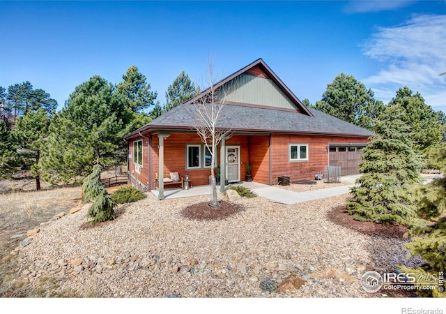 view of front of house with a garage and a porch