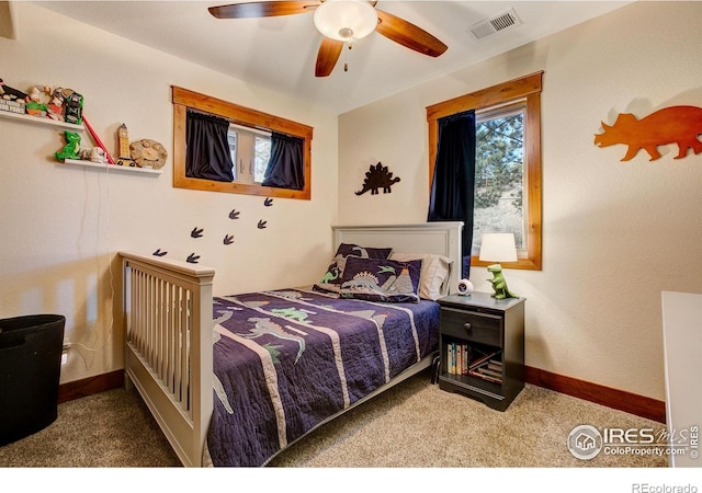 bedroom with visible vents, carpet flooring, a ceiling fan, and baseboards