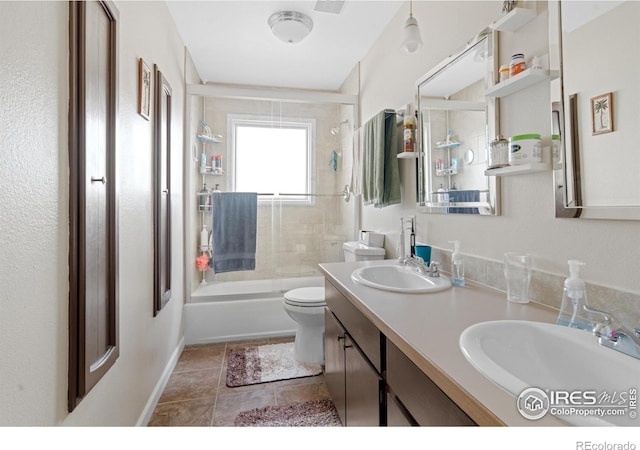 bathroom with double vanity, toilet, visible vents, and a sink