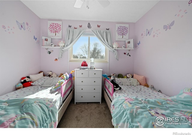 bedroom with ceiling fan and carpet