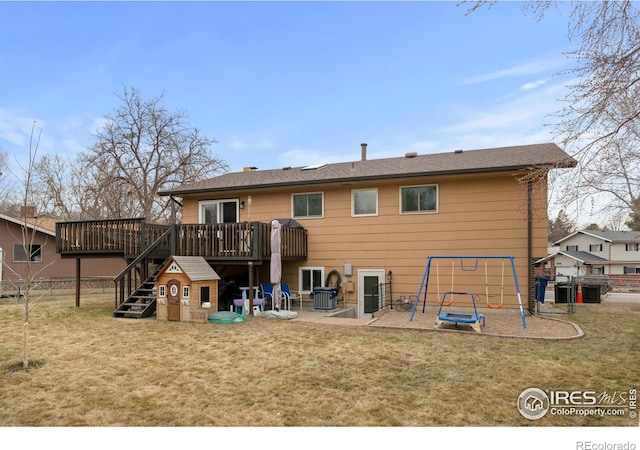 rear view of house featuring a patio area, a playground, a lawn, and fence