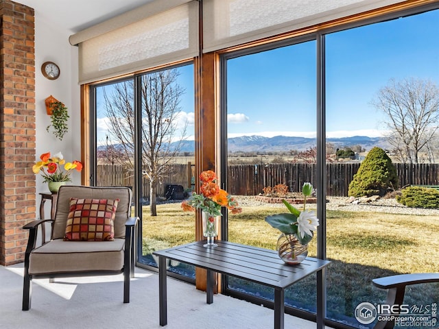 sunroom with a mountain view