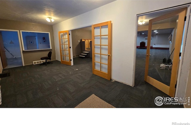 misc room featuring carpet flooring and french doors