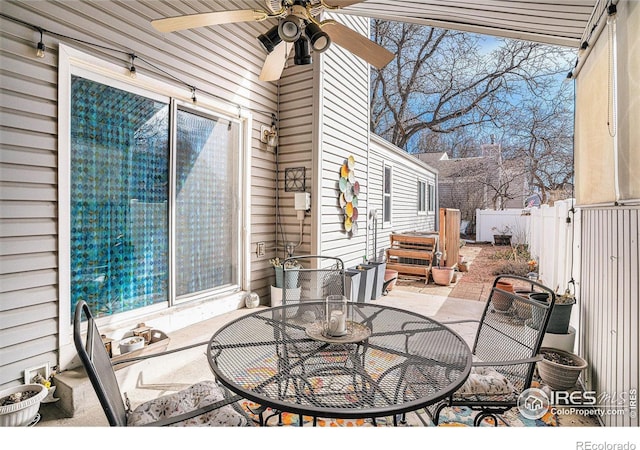 view of patio / terrace with outdoor dining area, a ceiling fan, and fence