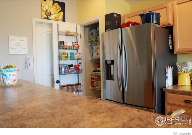 kitchen featuring stainless steel fridge