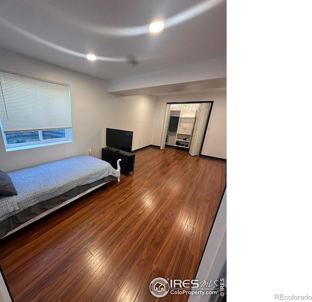 bedroom featuring wood finished floors