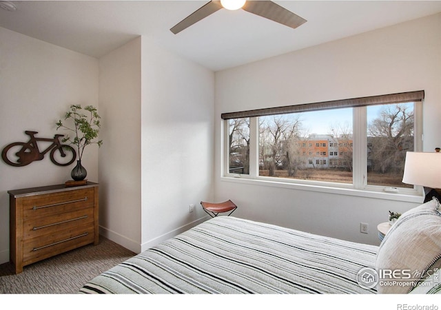 bedroom featuring baseboards, multiple windows, ceiling fan, and carpet flooring