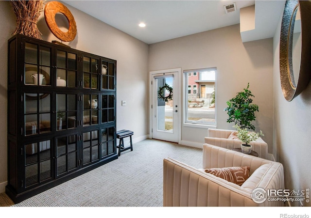 interior space with recessed lighting, visible vents, carpet flooring, and baseboards