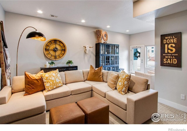 living room with recessed lighting, baseboards, carpet floors, and visible vents