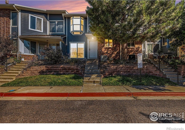 view of front of property featuring brick siding