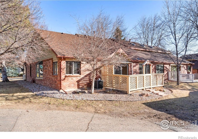 rear view of house with brick siding