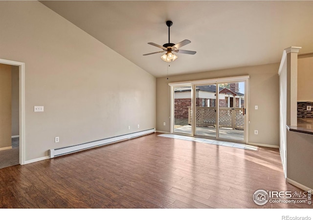 unfurnished living room with vaulted ceiling, baseboard heating, a ceiling fan, and wood finished floors