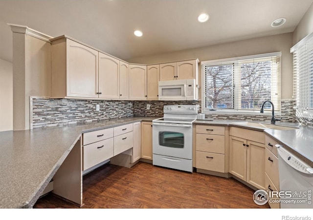 kitchen featuring a sink, tasteful backsplash, recessed lighting, white appliances, and dark wood-style flooring