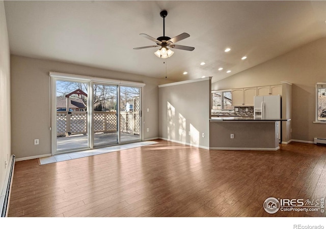 unfurnished living room with wood finished floors, a baseboard radiator, recessed lighting, ceiling fan, and vaulted ceiling