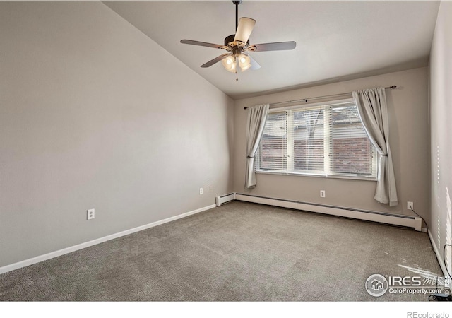 spare room featuring a ceiling fan, baseboard heating, carpet flooring, and vaulted ceiling