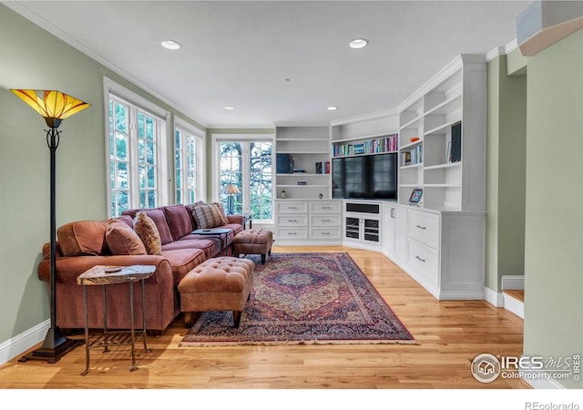 living area with crown molding, recessed lighting, baseboards, and light wood finished floors