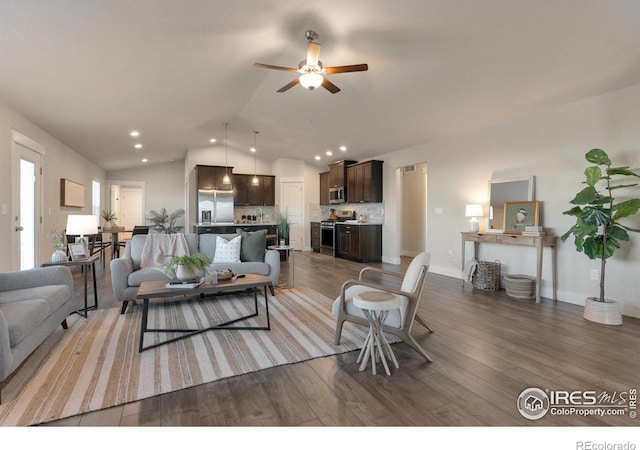 living room featuring a ceiling fan, lofted ceiling, recessed lighting, and wood finished floors