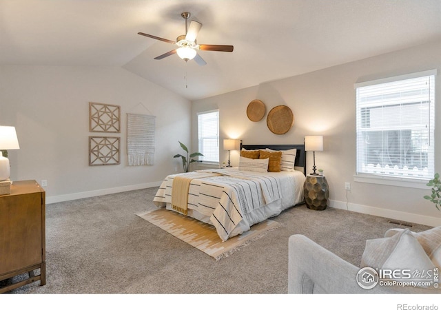 bedroom featuring lofted ceiling, carpet flooring, and baseboards