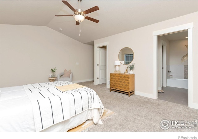 carpeted bedroom featuring vaulted ceiling, baseboards, and ceiling fan