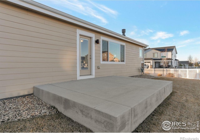 view of patio featuring fence