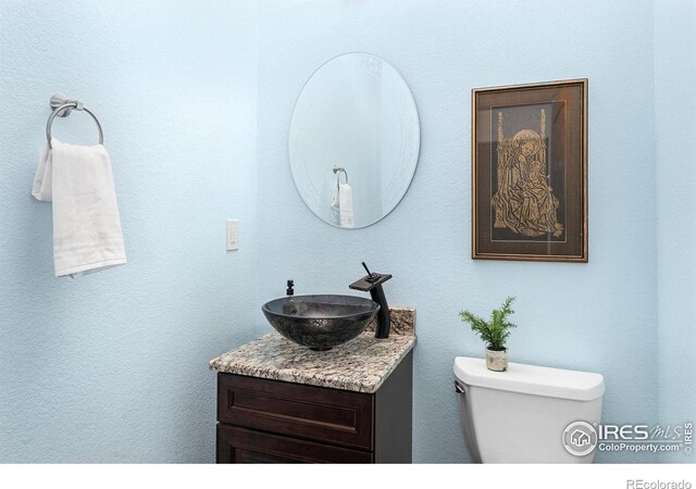 half bath with toilet and vanity