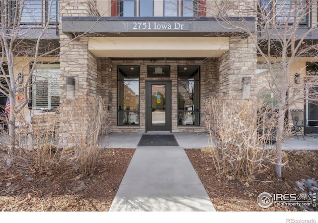 view of exterior entry with stone siding