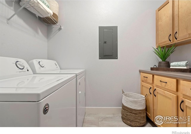 laundry area with marble finish floor, independent washer and dryer, electric panel, cabinet space, and baseboards