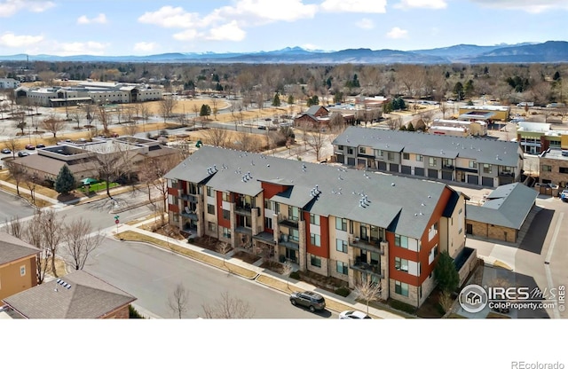 aerial view featuring a mountain view and a residential view