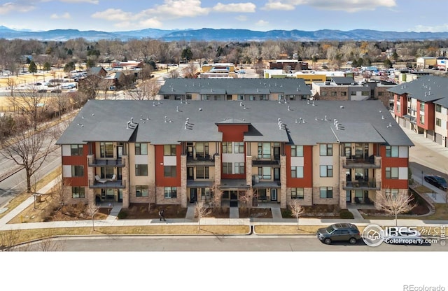 drone / aerial view with a mountain view and a residential view