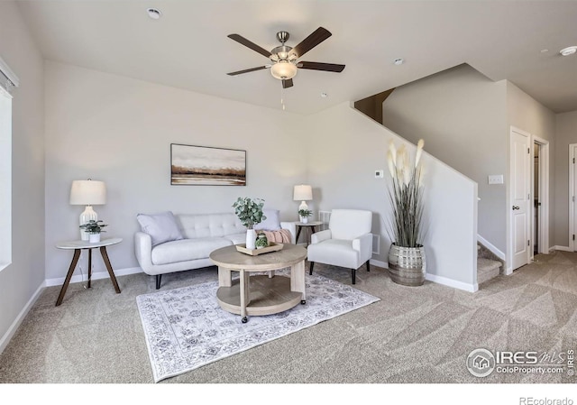 143 Robin Rd, Johnstown, CO 80534 - carpeted living room with a ceiling fan, stairs, and baseboards