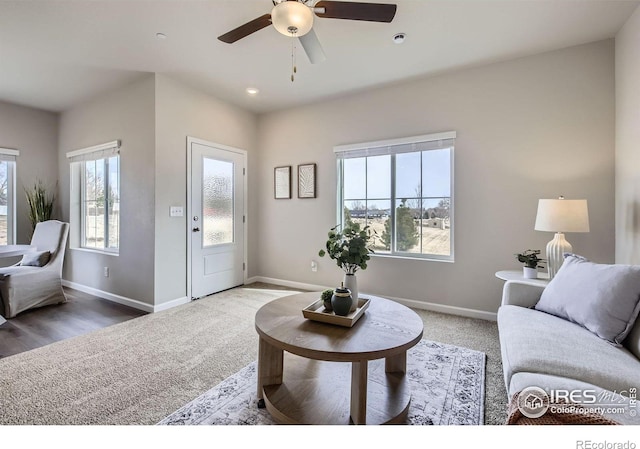 143 Robin Rd, Johnstown, CO 80534 - carpeted living room with recessed lighting, baseboards, and a ceiling fan