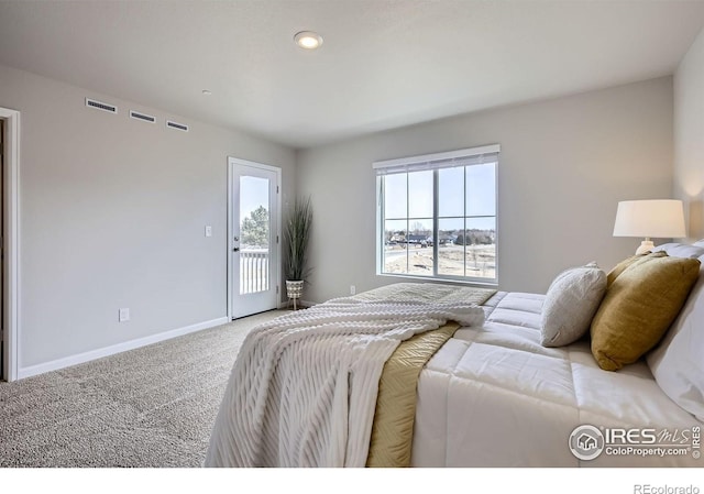 143 Robin Rd, Johnstown, CO 80534 - carpeted bedroom featuring visible vents, baseboards, and access to outside