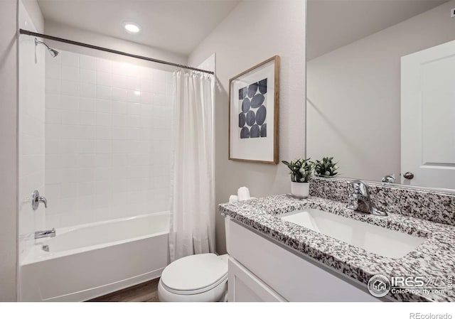 143 Robin Rd, Johnstown, CO 80534 - bathroom featuring vanity, wood finished floors, recessed lighting, shower / bath combo, and toilet
