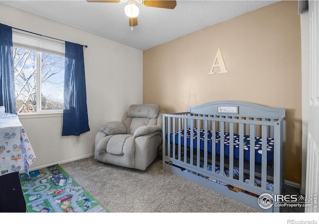 bedroom with a textured ceiling, a ceiling fan, baseboards, and carpet floors