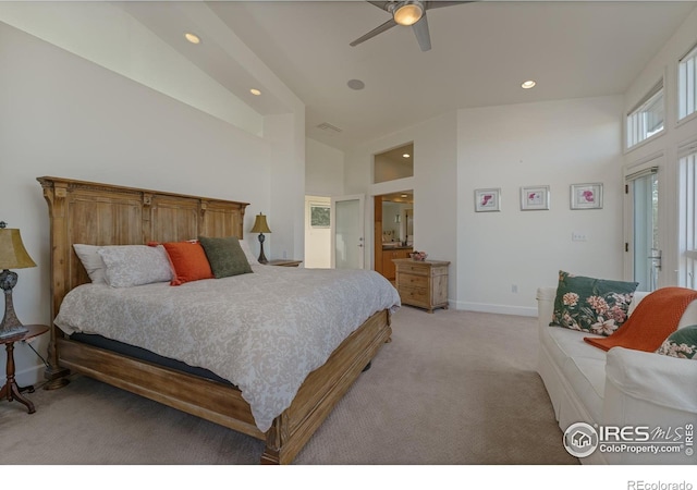 bedroom with a ceiling fan, recessed lighting, baseboards, light colored carpet, and a towering ceiling