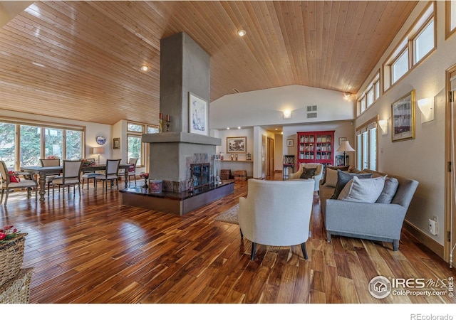 living room with high vaulted ceiling, hardwood / wood-style floors, a fireplace, baseboards, and wood ceiling