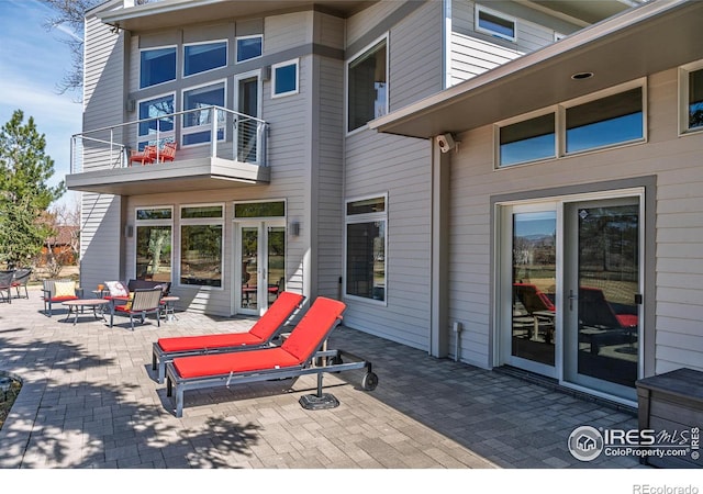 wooden deck featuring a patio area