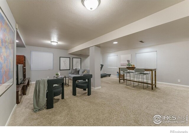 playroom with carpet flooring, baseboards, and visible vents