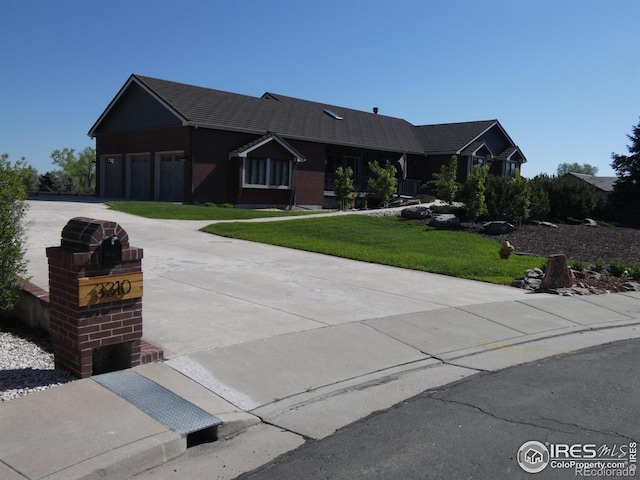 3310 Routt St, Wheat Ridge, CO 80033 - ranch-style home with a garage, driveway, and a front yard