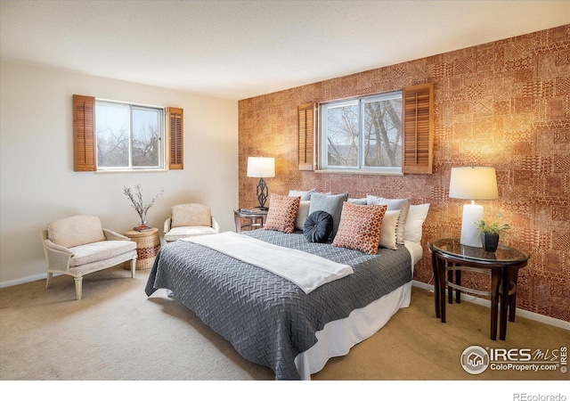 carpeted bedroom with baseboards