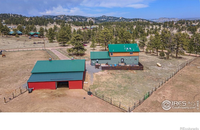 bird's eye view featuring a mountain view and a rural view