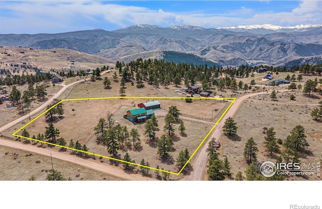 aerial view featuring a mountain view and a rural view