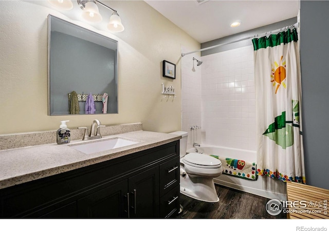 bathroom featuring shower / bath combination with curtain, toilet, vanity, and wood finished floors